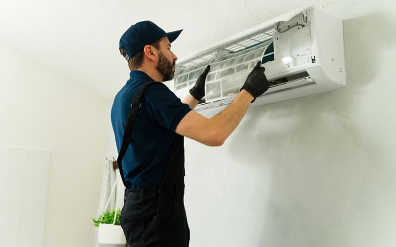 HVAC contractor installing a new air conditioning unit