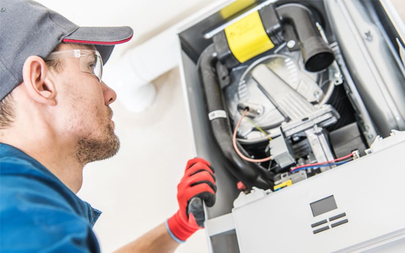 HVAC professional replacing a furnace